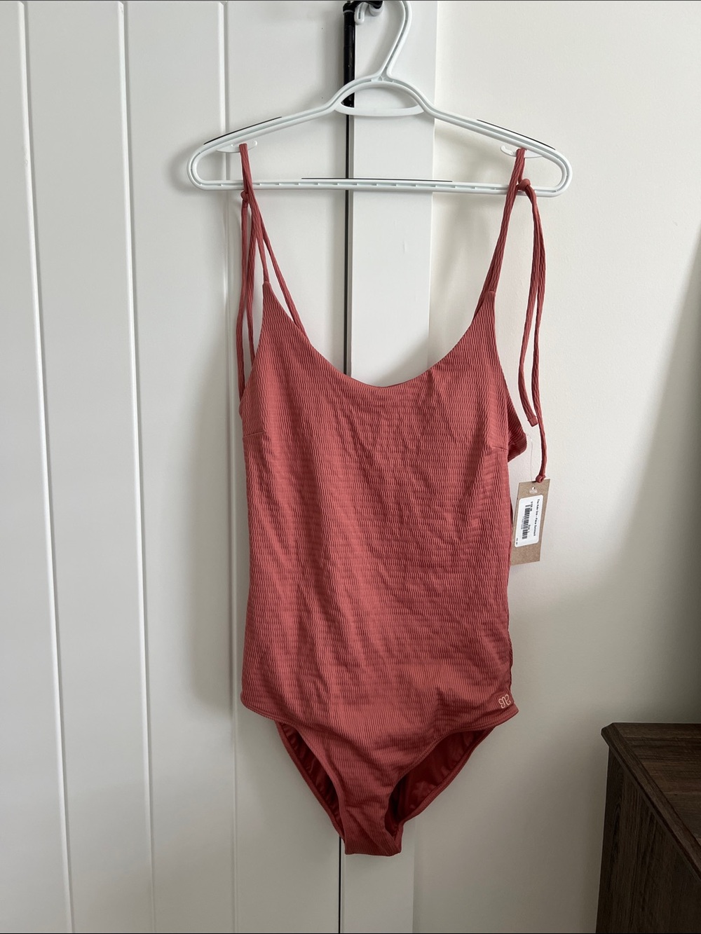 Albion fit Pink One piece suit with adjustable Tie Straps.